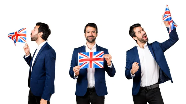 Hombre guapo sosteniendo una bandera británica —  Fotos de Stock