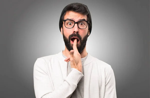 Hipster man making suicide gesture on grey background — Stock Photo, Image