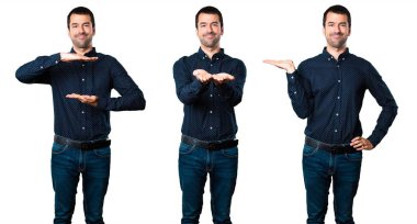 Yakışıklı adam bir şey tutan kümesi