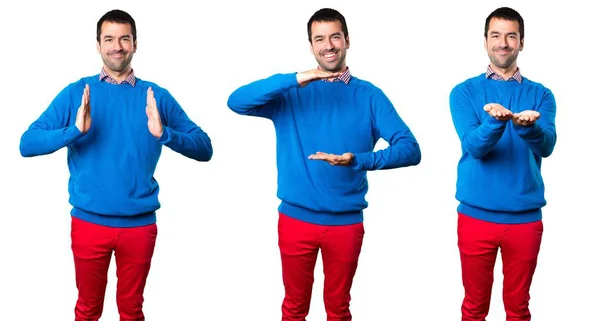 Set of Handsome young man holding something — Stock Photo, Image