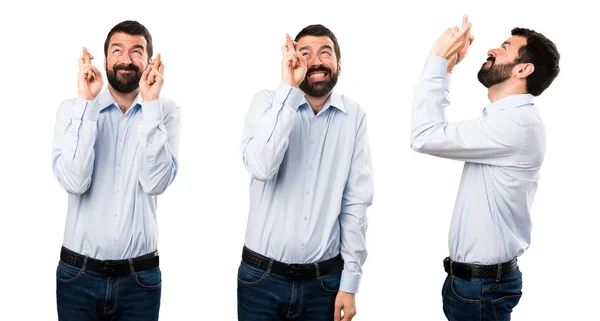 Conjunto de homem bonito com barba com os dedos cruzando — Fotografia de Stock