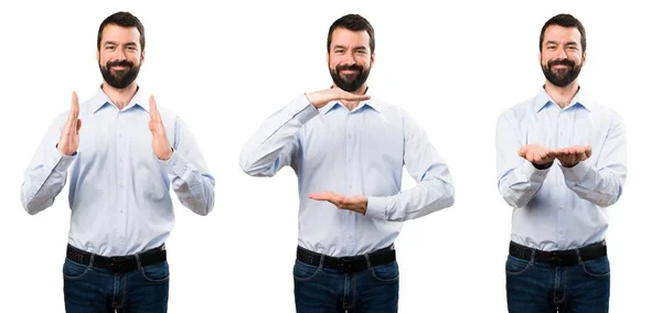 Conjunto de homem bonito com barba segurando algo — Fotografia de Stock