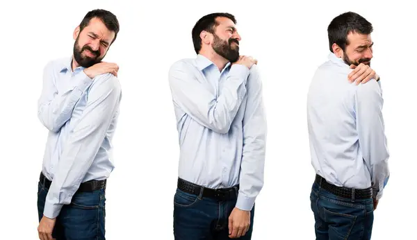 Joukko Komea mies parta olkapää kipu — kuvapankkivalokuva