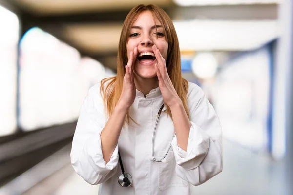 Young doctor woman shouting in the hospital