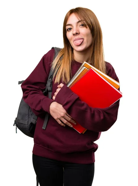 Studerande kvinna tar ut tungan — Stockfoto