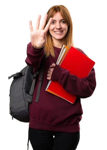 Estudante mulher contando quatro — Fotografia de Stock