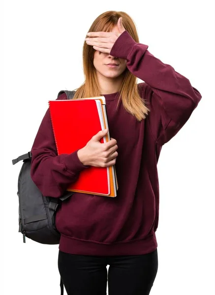 Student vrouw die betrekking hebben op haar ogen — Stockfoto