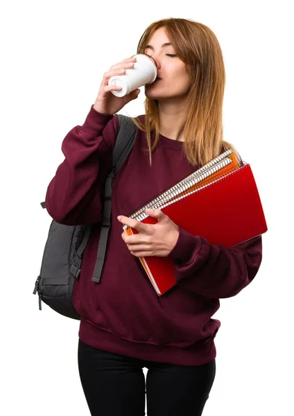 Student-kvinna som håller en kopp kaffe — Stockfoto