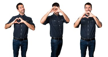 Esmer adam elleriyle bir kalp yapma kümesi