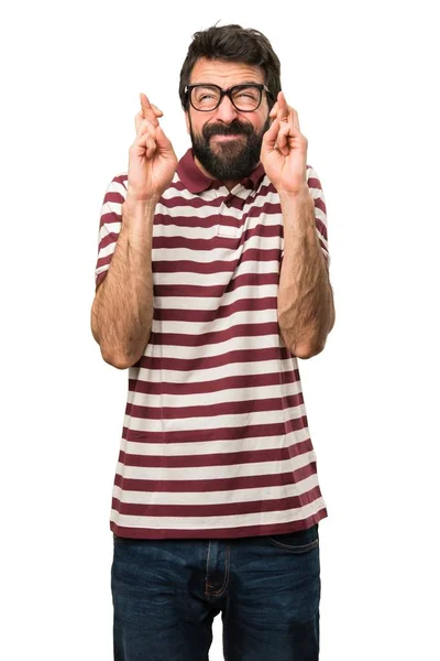 Man with glasses with his fingers crossing — Stock Photo, Image