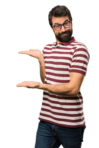 Man with glasses presenting something — Stock Photo, Image
