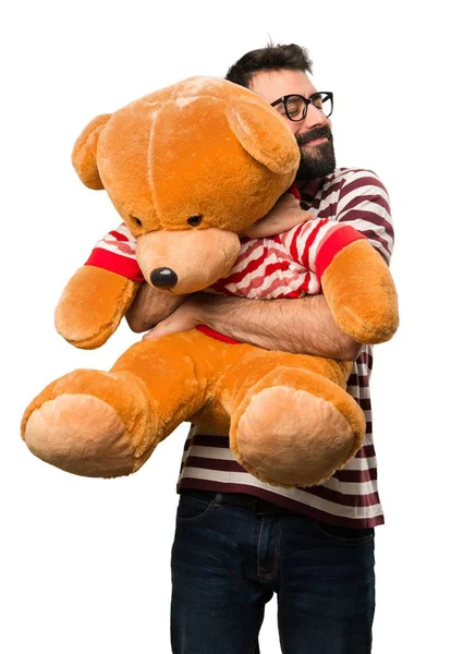 Man with glasses playing with stuffed animal — Stock Photo, Image