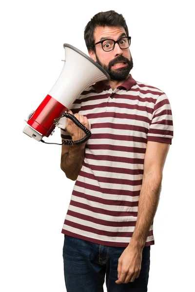 Man with glasses holding a megaphone — Stock Photo, Image