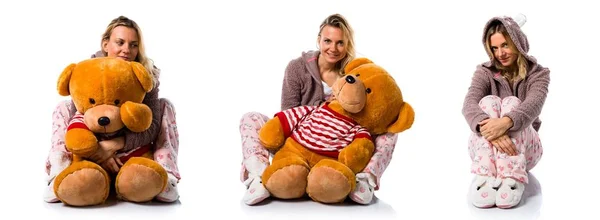 Pretty blonde girl in cute pajamas with big stuffed animal — Stock Photo, Image