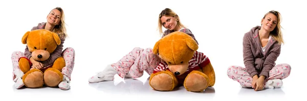 Pretty blonde girl in cute pajamas with big stuffed animal — Stock Photo, Image