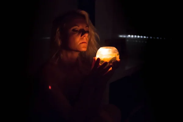 Girl inside her room in the night with candle — Stock Photo, Image