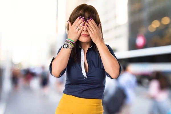 Pretty woman covering her eyes — Stock Photo, Image