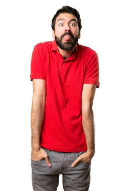 Yakışıklı adam, dilini alarak