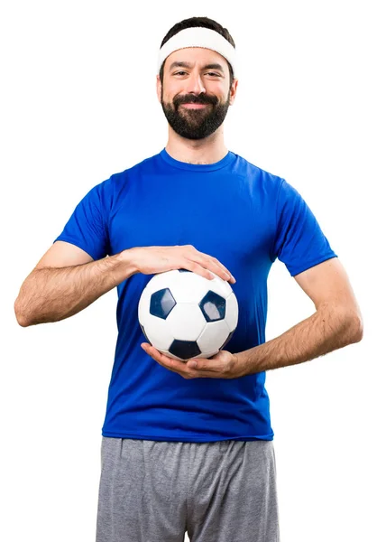 Feliz deportista divertido sosteniendo una pelota de fútbol en aislado ba blanca —  Fotos de Stock