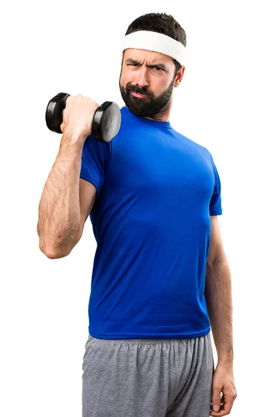 Esportista engraçado fazendo levantamento de peso em backgroun branco isolado — Fotografia de Stock