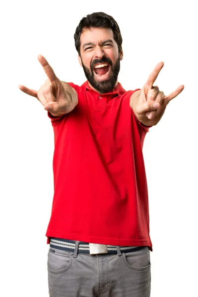 Pohledný muž rock gesto — Stock fotografie