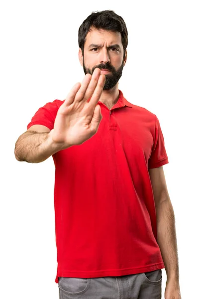 Bonito homem fazendo sinal de parada — Fotografia de Stock