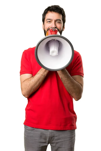 Handsome man holding a megaphone — Stock Photo, Image