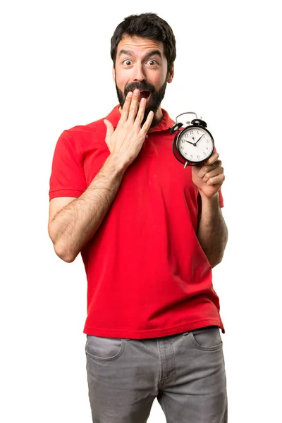Surpreendido Bonito homem segurando relógio vintage — Fotografia de Stock