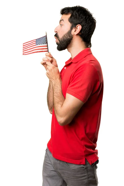 Hombre guapo sosteniendo una bandera americana —  Fotos de Stock