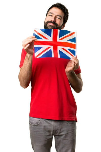 イギリスの旗を保持している幸せなハンサムな男 — ストック写真