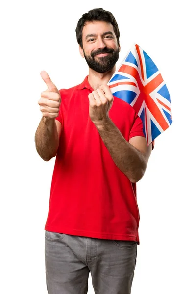イギリスの旗を保持している幸せなハンサムな男 — ストック写真