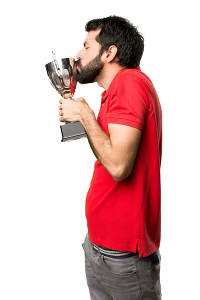 Handsome man holding a trophy Stock Picture