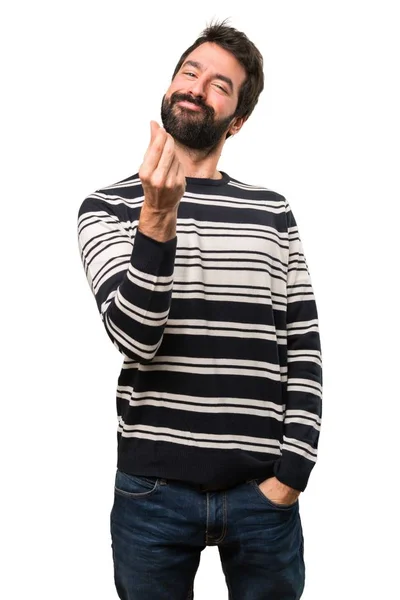 Человек с бородой делает денежный жест — стоковое фото