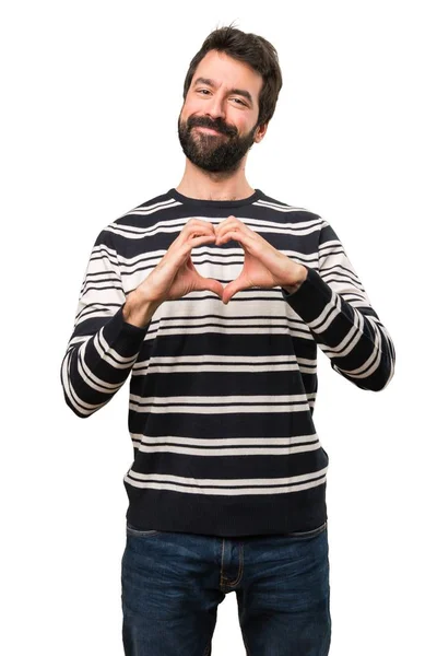 Hombre con barba haciendo un corazón con sus manos —  Fotos de Stock