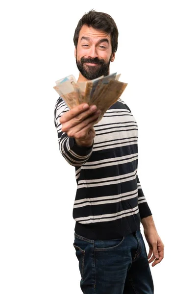 Hombre feliz con barba cogiendo mucho dinero — Foto de Stock
