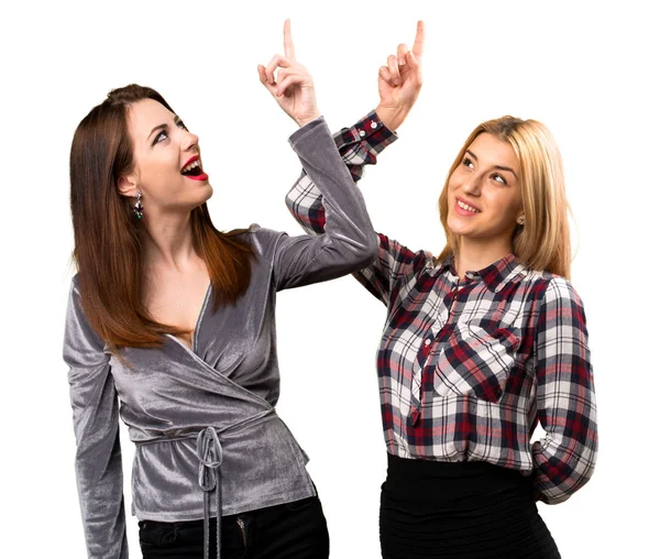 Two friends pointing up — Stock Photo, Image