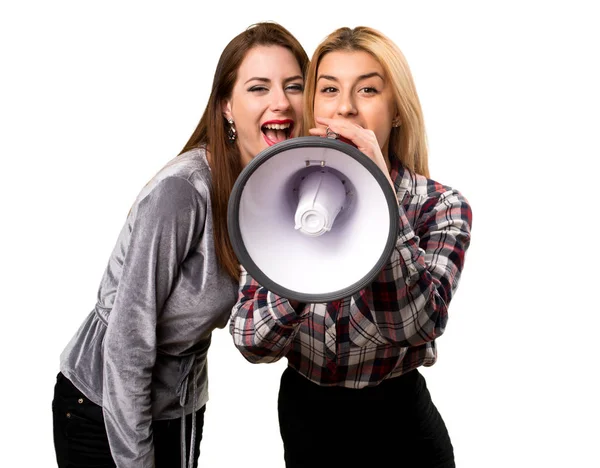 Two friends holding a megaphone — Stock Photo, Image