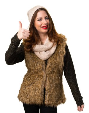 Başparmak ile kış kıyafetleri ile kız