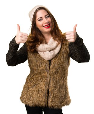 Başparmak ile kış kıyafetleri ile kız