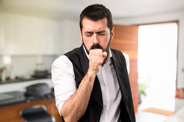 Cool man coughing a lot inside house
