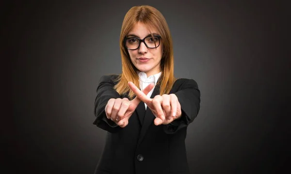 Young business woman making NO gesture on dark background — Stock Photo, Image