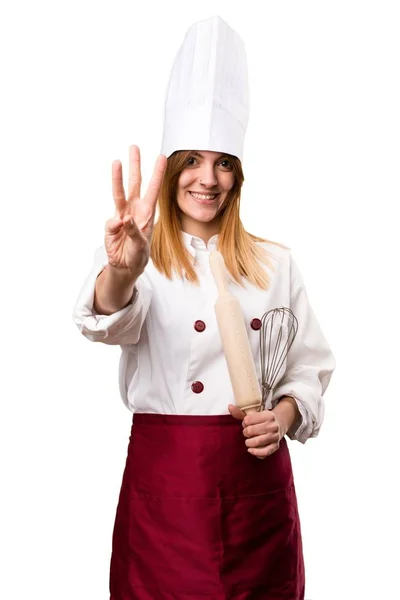 Prachtige chef-kok vrouw tellen drie — Stockfoto