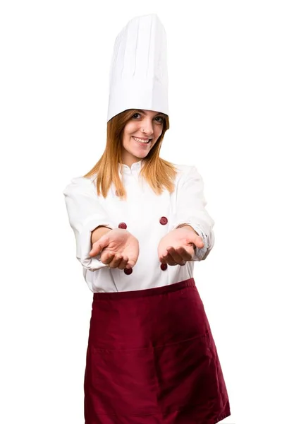 Hermosa mujer chef sosteniendo algo —  Fotos de Stock