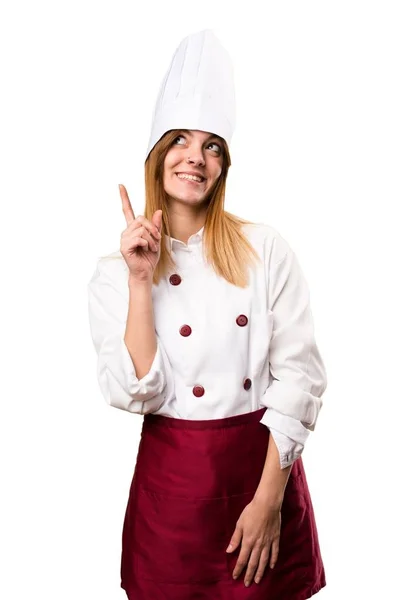 Hermosa mujer chef apuntando hacia arriba —  Fotos de Stock