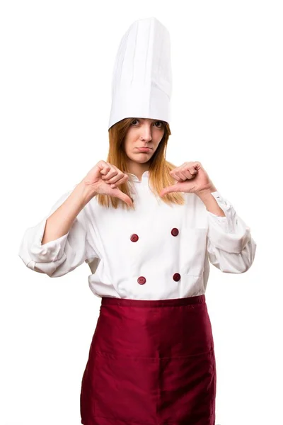 Beautiful chef woman making bad signal — Stock Photo, Image