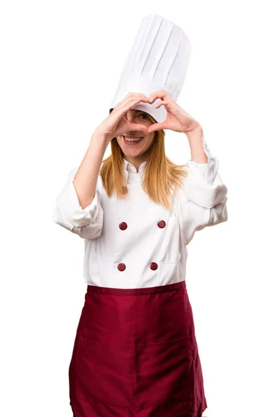 Hermosa mujer chef haciendo un corazón con sus manos —  Fotos de Stock
