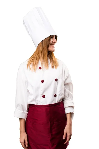Mulher chef bonita olhando lateral — Fotografia de Stock