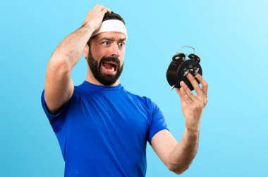 Komik sporcu Vintage saat renkli arka plan üzerinde tutan