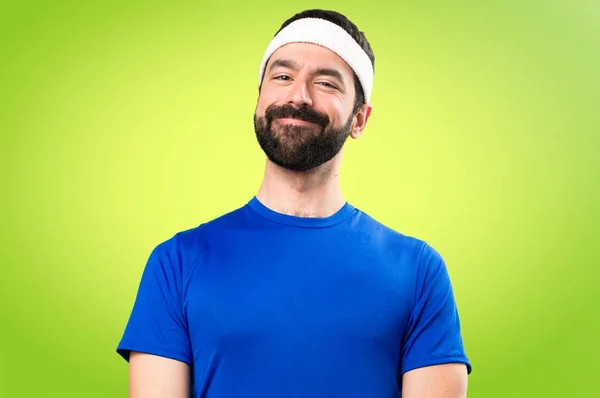 Happy funny sportsman on colorful background — Stock Photo, Image