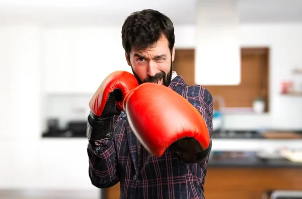 Well dressed man with boxing gloves inside house — Stock Photo, Image